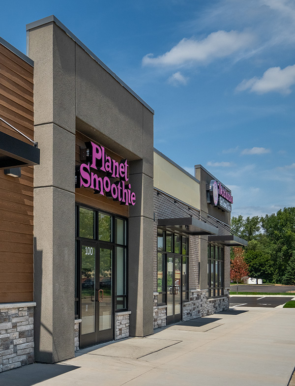 Exterior of the Great Steak and Planet Smoothie location, showcasing modern signage, large glass storefront windows, and a clean, inviting commercial entryway.