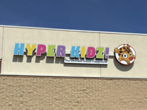 Exterior signage for the Hyper Kidz facility in Blaine, Minnesota.