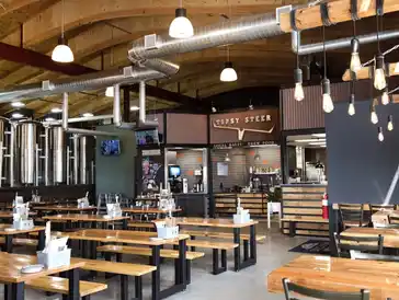 Professional commercial kitchen and restaurant dining area built by GCM Construction.